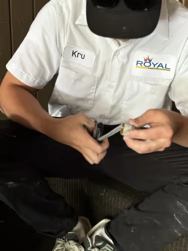 Royal Technician prepping a pipe fitting with tape