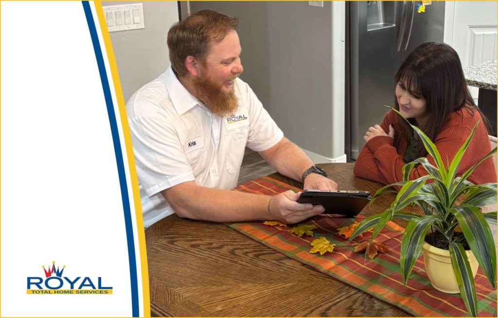 AnHVAC technician and a homeowner discussing the size of the air-conditioning unit that the home needs